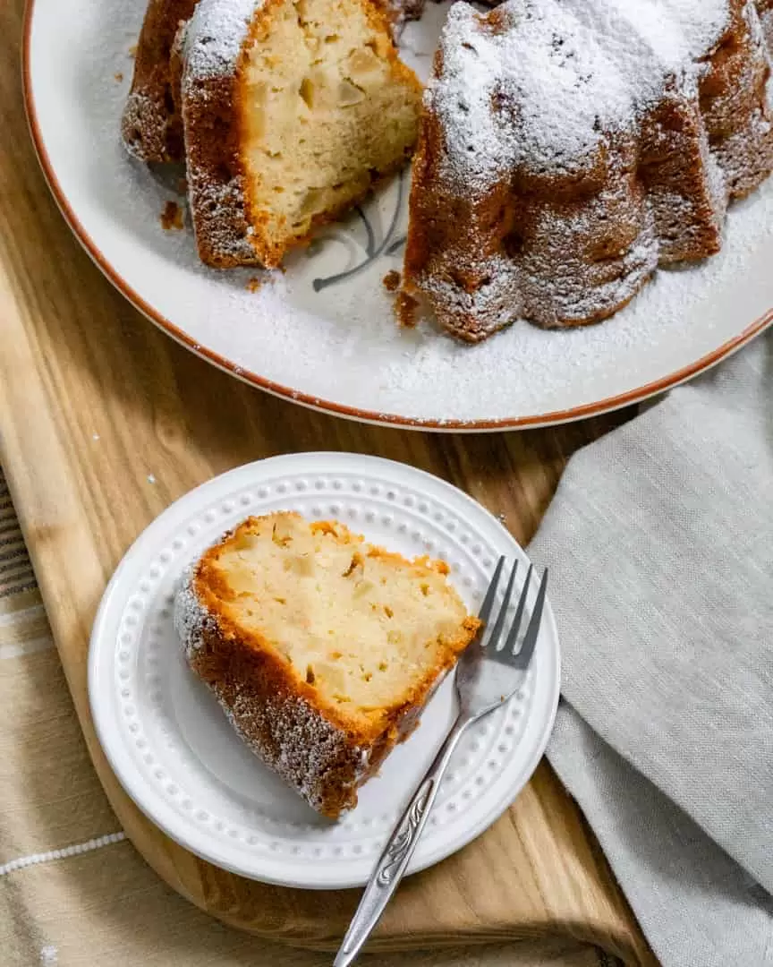 a piece of cozy apple bundt cake on a plate