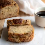 sliced date orange banana bread with coffee