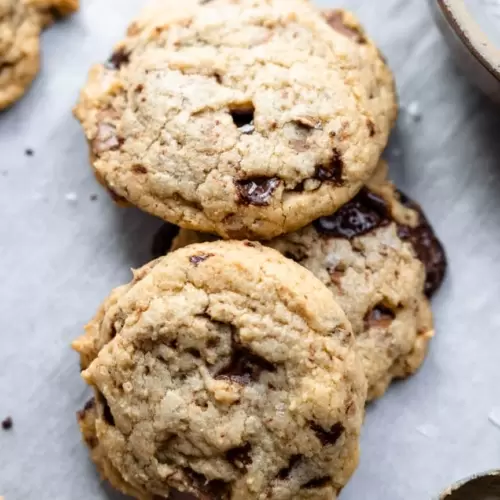 Chocolate Chip Cookies stacked on top of each other.