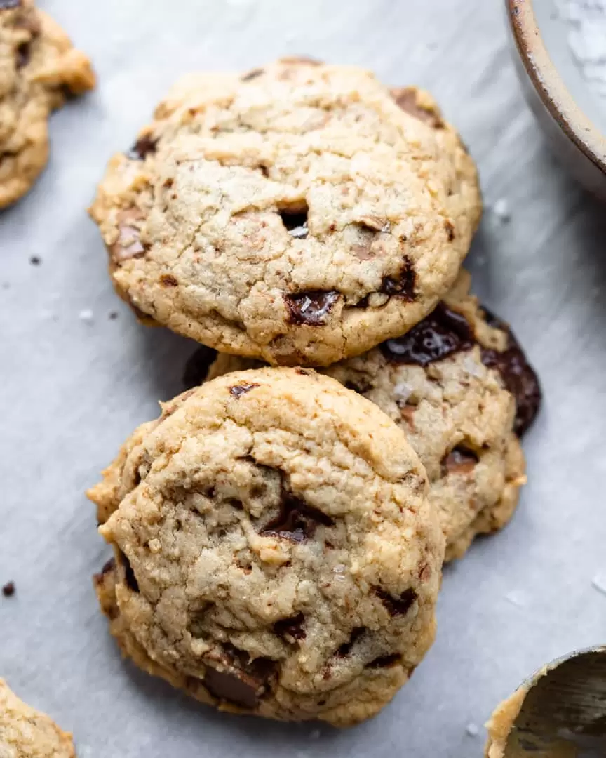 Chocolate Chip Cookies stacked on top of each other.