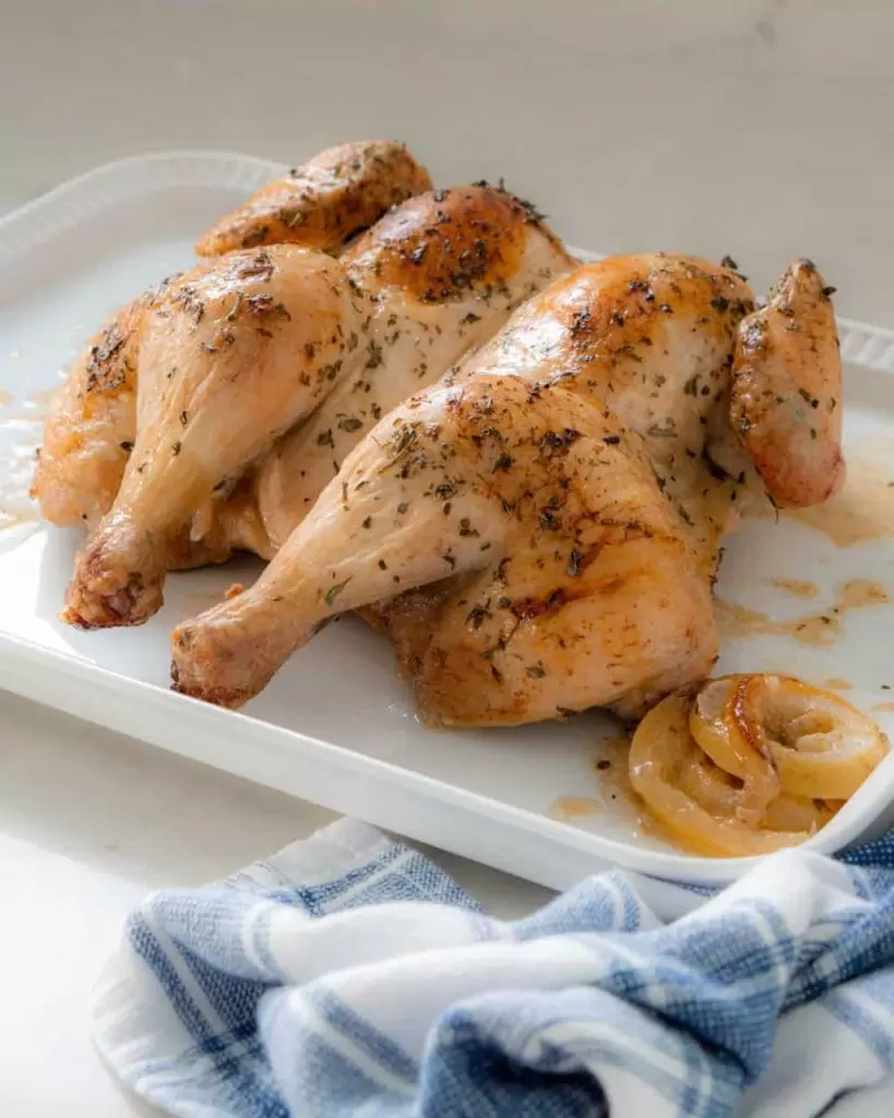 Chicken with herbs on a platter