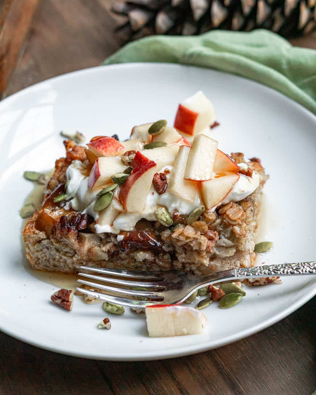 apple and cinnamon baked oatmeal on a plate.