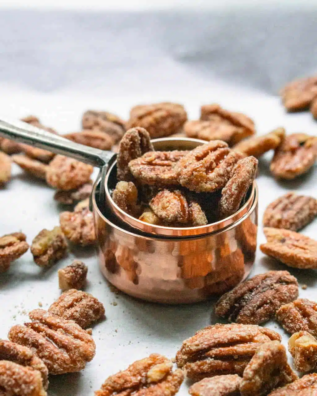 Maple Glazed Pecans in a Measuring Cup