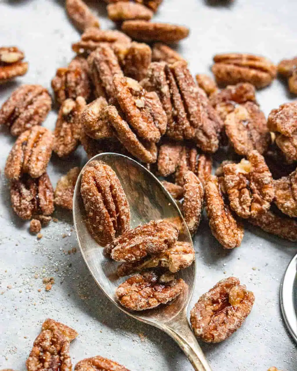 glazed pecans on a spoon