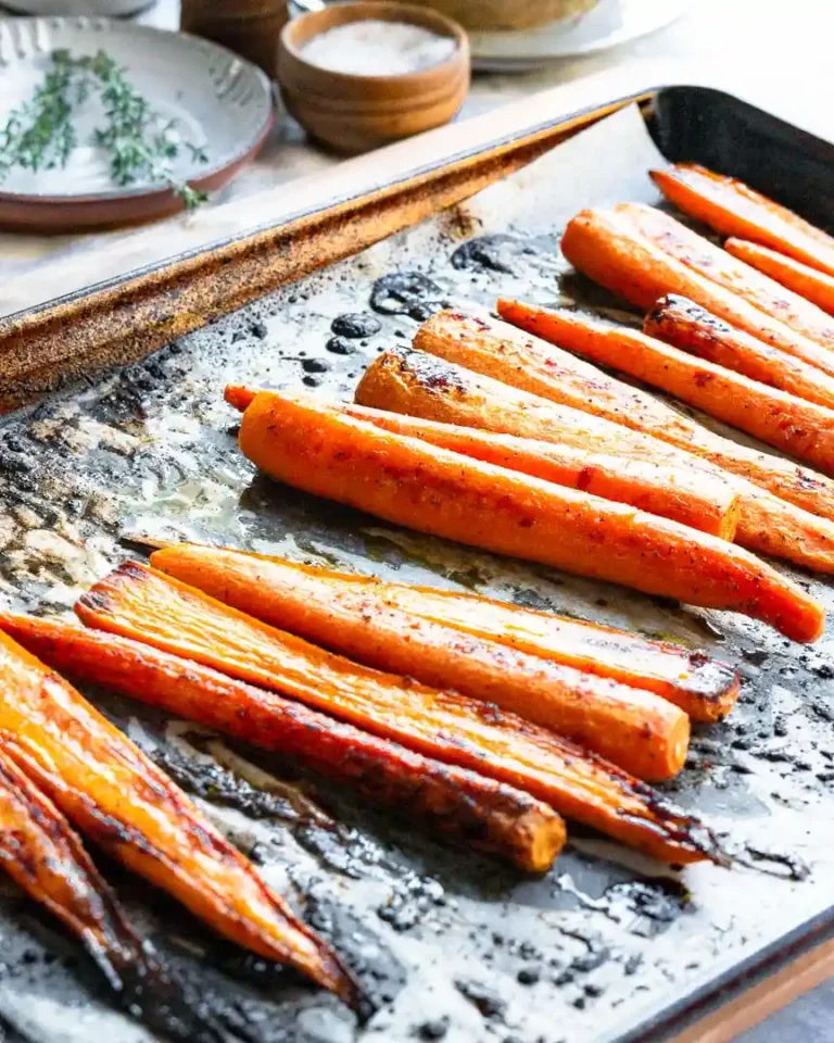 Roasted carrots on a baking sheet.