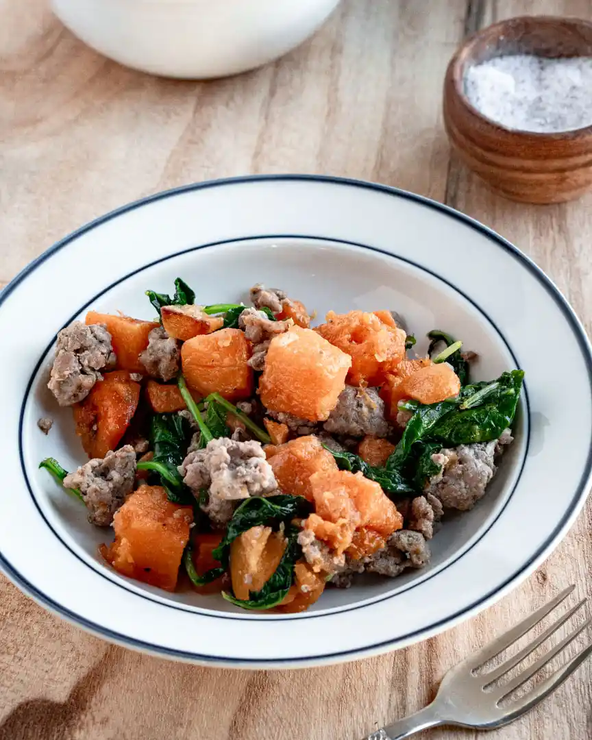 Butternut squash and sausage in a bowl