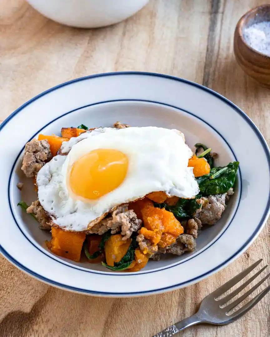 Fried egg on top of a breakfast hash