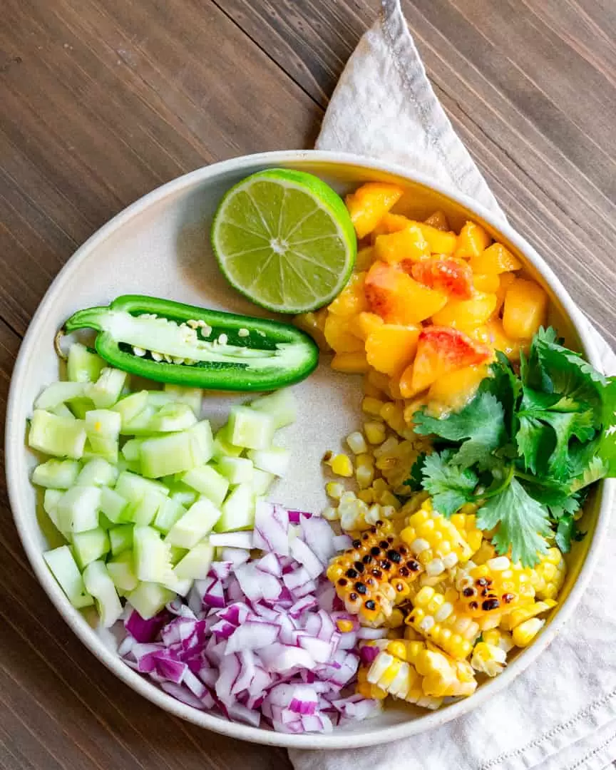 plate with salsa ingredients in separate piles.