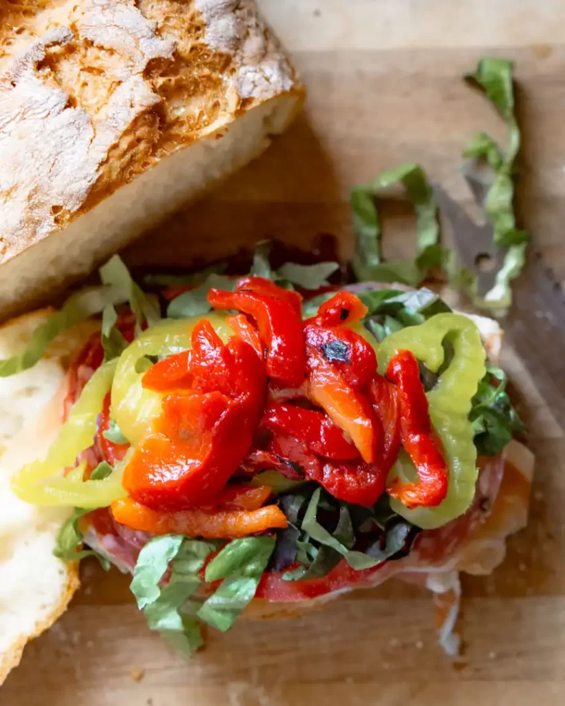 Open faced sandwich with roasted red peppers on top