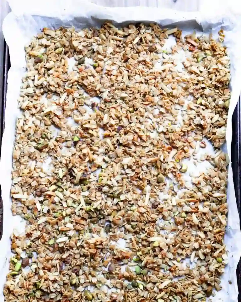 Toasted granola on a baking sheet.