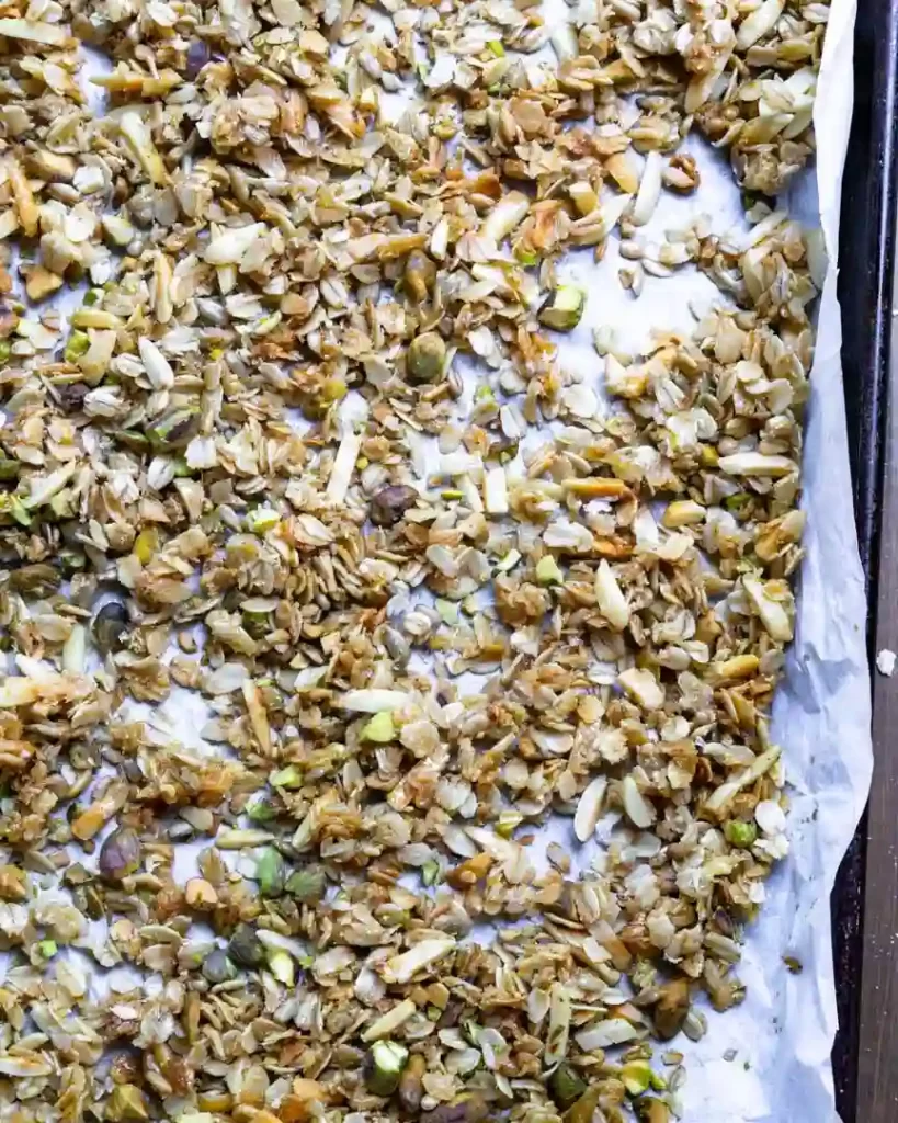 Raw granola on a baking sheet