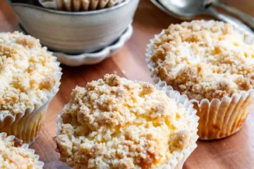 Muffins on a wood board.