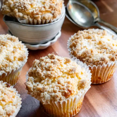 Muffins on a wood board.