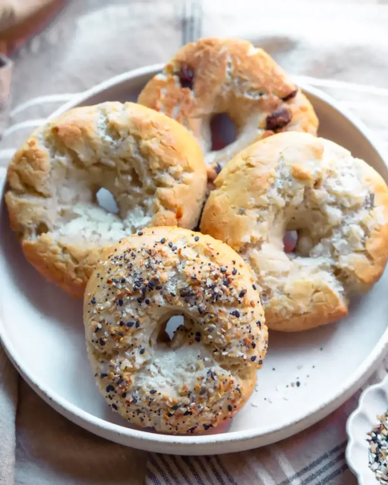 Assorted bagels on a plate.