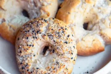 A plate of assorted high protein bagels.