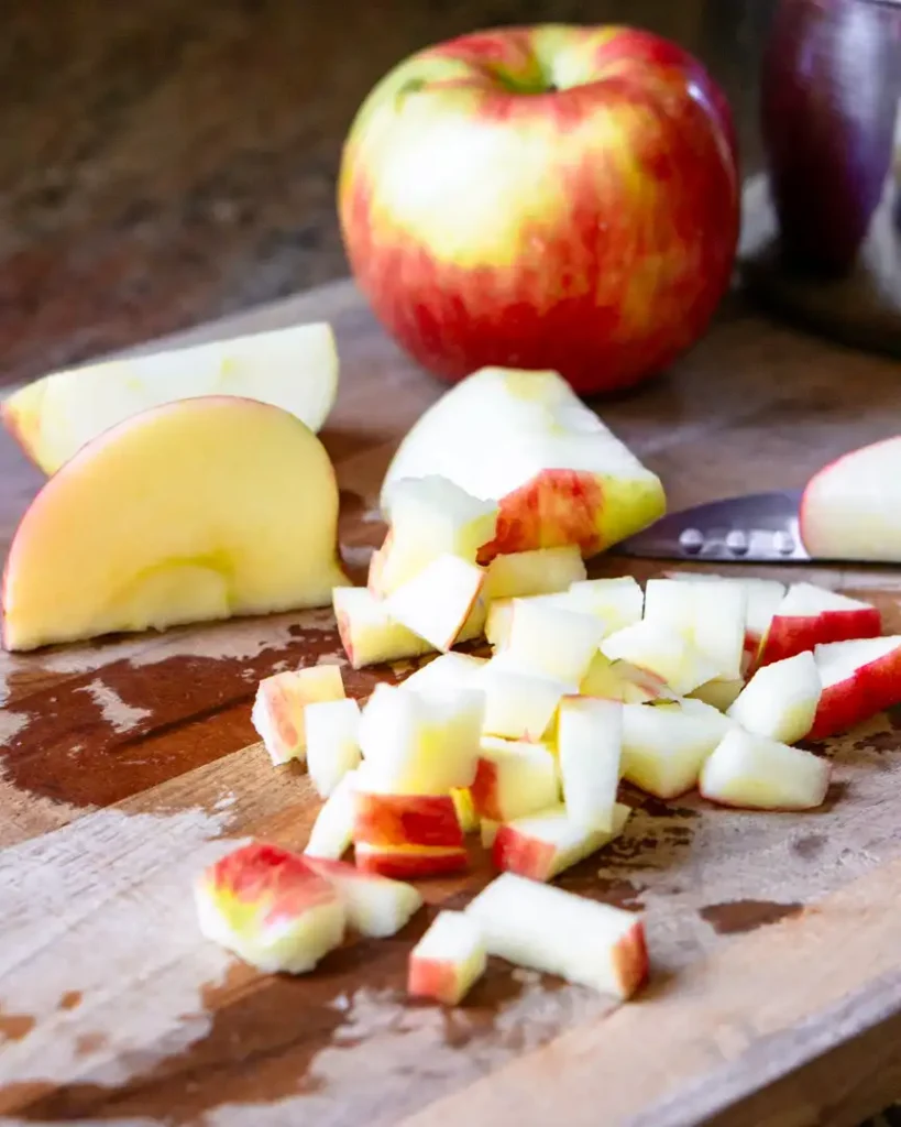 Chopped apples on a cutting board.