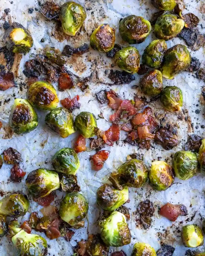 Roasted bacon and brussels sprouts on a baking sheet