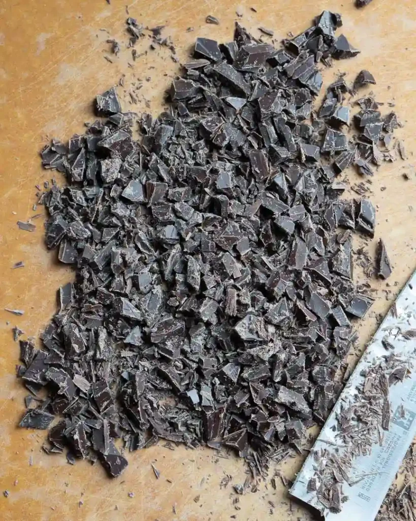 A chocolate bar chopped into small pieces.