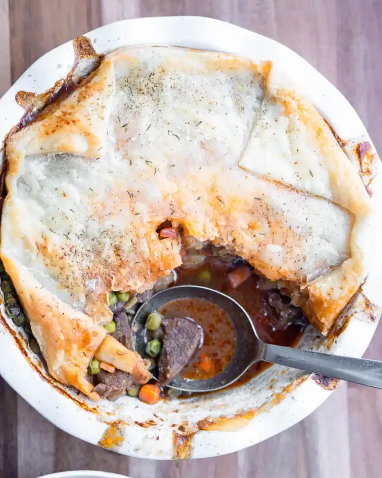 Beef pot pie with a scoop missing.